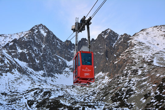 TATRANSKA LOMNICA, SLOVAKIA - JANUARY 1, 2016: Red cable car going to Lomnicky stit peak. It is one of the steepest cable cars in Europe