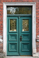 Fototapeta na wymiar emerald green wooden double doors