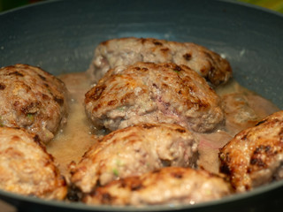 cutlets are cooked in a pan