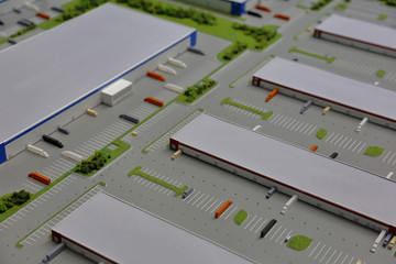 Miniature plastic model of an industrial zone with warehouses, workshops and storages