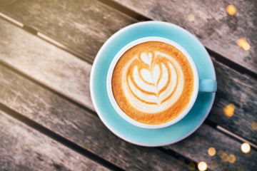 Fresh flavored coffee art on wooden background.