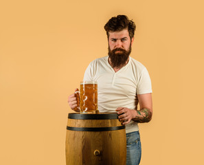 Oktoberfest festival. Bearded man hold glass with delicious ale. Bearded man drinking ale. Man tasting draft beer. Beer pub and bar. Brewer. Brewery concept. Craft beer at restaurant. Beer in Germany.