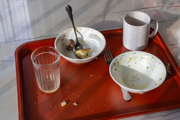 Leftovers on the dining room table. Dirty cups and plates on the table, all inclusive