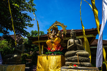 Ganesha Statue, Balinese style and decorations in front of a Balinese temple. Bali, Indonezia, 2019.