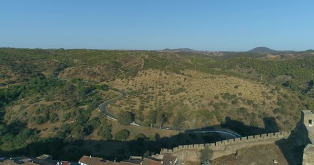 Aerial view of the town of Mertola in southeastern Portuguese Alentejo destination region, located in the margin of Guadiana River, whit its medieval castle, located on the highest point. Portugal.