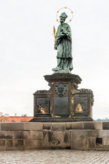 Statue of St. John of Nepomuk on Charles Bridge in Prague, Czech Republic.
