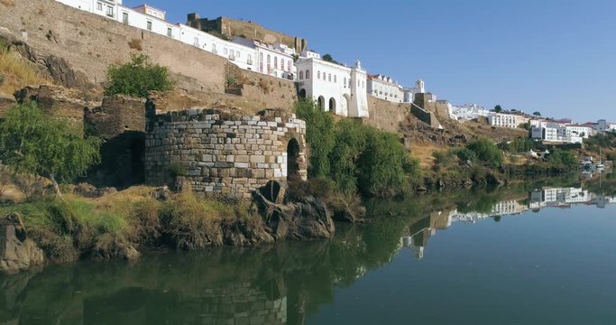 Aerial view of the town of Mertola in southeastern Portuguese Alentejo destination region, located in the margin of Guadiana River, whit its medieval castle, located on the highest point. Portugal.