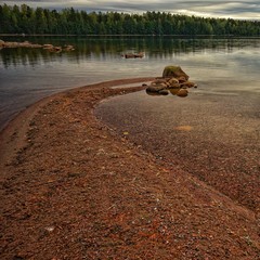 Sand bank in the calm lake