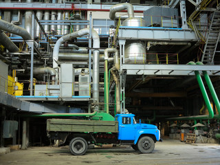 Industrial big water pumps with electric motors, pipes, tubes, equipment and steam turbine at power plant