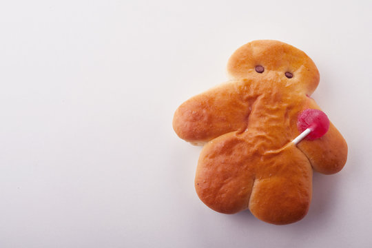 Mini Stutenkerl with lollipop on white