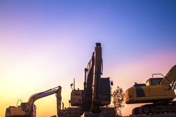 excavator at construction site © Thongtu