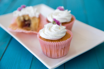 cupcakes on blue wooden background