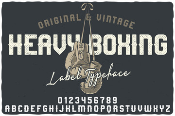 Vintage label font named Heavy Boxing. Letters and numbers set. Label with illustration and text composition.