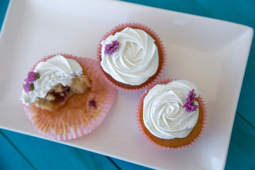 cupcakes on blue wooden background