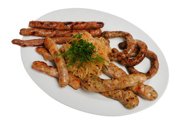 Raw pork sausages closeup view. Hunting grilled sausages on a plate isolated on white background