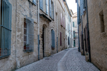 Fototapeta na wymiar Streets and typical buildings of Uzes at the Department of Gard, France