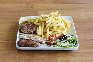 meat and vegetable sandwich white fries.