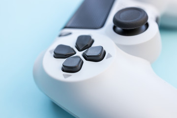 Video games white gaming controller isolated on blue color background top view