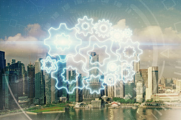 Obraz na płótnie Canvas Double exposure of business theme hologram drawing and city veiw background. Concept of success.