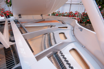 White piano with flowers in the background