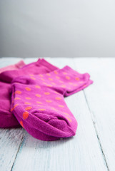 pink socks on white wooden