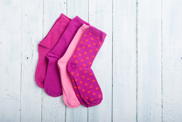 pink socks on white wooden