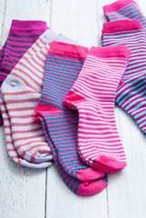 striped socks on white wooden