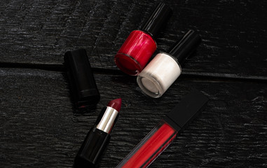 Various cosmetics on a black background. Beauty products, close up photo.