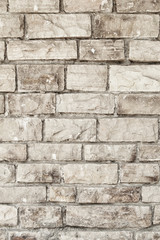 Wall of stone grey bricks, abstract background. Brick wall building