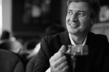 Businessman relaxing at the coffee shop in Bangkok, Thailand