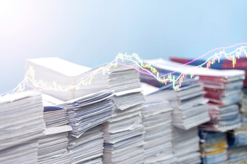 Double exposures stack of document and stock chart.