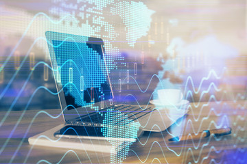 Stock market graph and table with computer background. Multi exposure. Concept of financial analysis.
