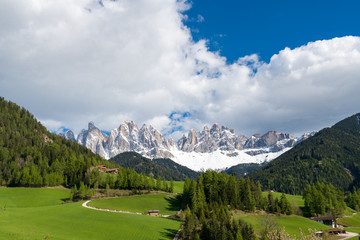 Fototapeta na wymiar Amazing landscape of val di funes in south Tyrol, Italy. Famous tourist spot at Santa Maddalena church with background of Dolomites rocky mountain.