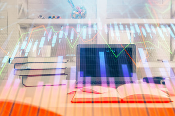 Stock market chart hologram drawn on personal computer background. Double exposure. Concept of...