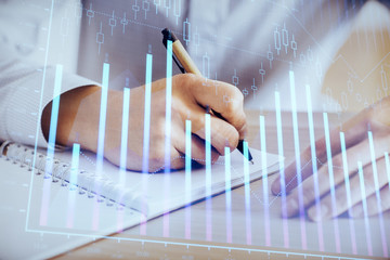 Multi exposure of man planing investment with stock market forex chart.