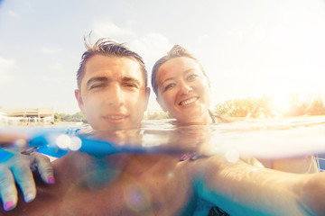 Couple having fun in swimming-pool