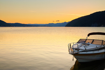 boat on a lake at sunrise