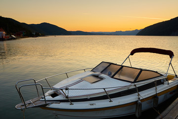 boat on a lake at sunrise
