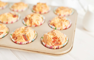 ham and cheese muffins on white wooden background