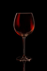 glass of red wine on black background