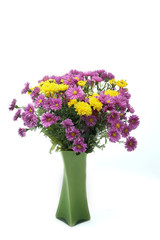 bouquet of flowers in glass vase isolated on white