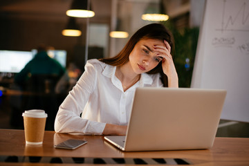 Portrait of tired businesswoman