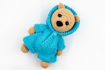 Funny handmade knitted toy bear .on white background. Amigurumi toy. Crochet stuffed animals.