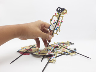 Indonesian Traditional Ethnic Artistic Vintage Handmade Leather Shadow Puppet in White Isolated...