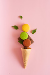 macaroon on a pink background with ice cream and chocolate sweet dessert