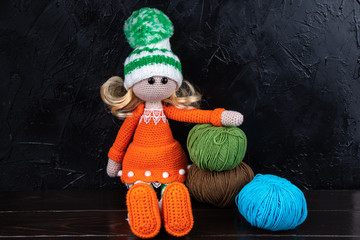 Knitted toy doll. Amigurumi toy. Crochet stuffed animals.