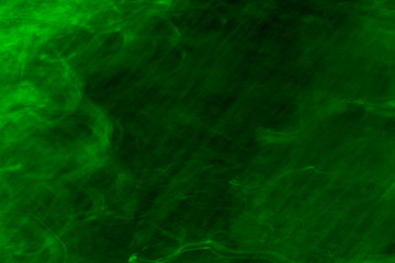 Obraz na płótnie Canvas Dark green abstract blurry textured background