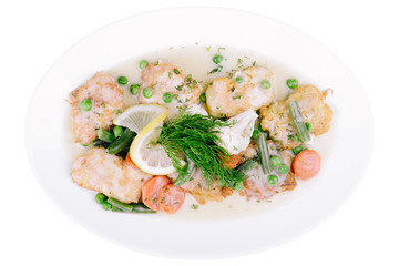 Grilled fish fillet in sauce with asparagus isolated on a white background