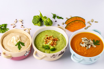 Variety of vegetables cream soups: with broccoli, white beans and pumpkins, ingredients for soup, healthy eating concept, Closeup, Top view, Horizontal orientation