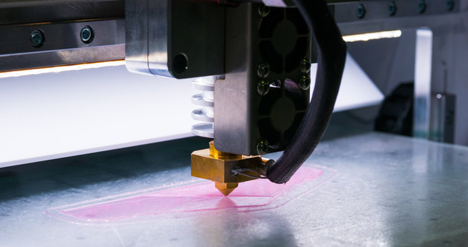 3D printing technology concept - three dimensional printing machine making physical 3D model at modern technology exhibition.